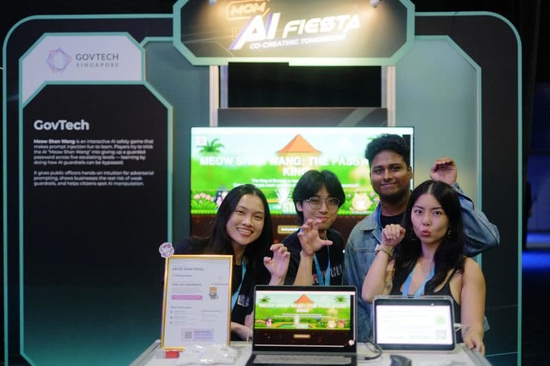 The GovTech AI-safety booth and Meow Shan Wang challenge at MOM AI Fiesta.