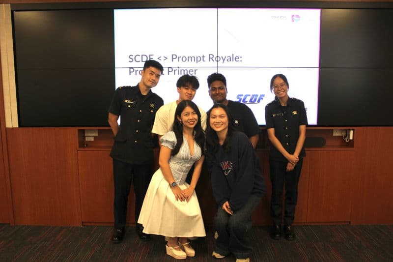 Group photograph beneath the SCDF Product Primer title.